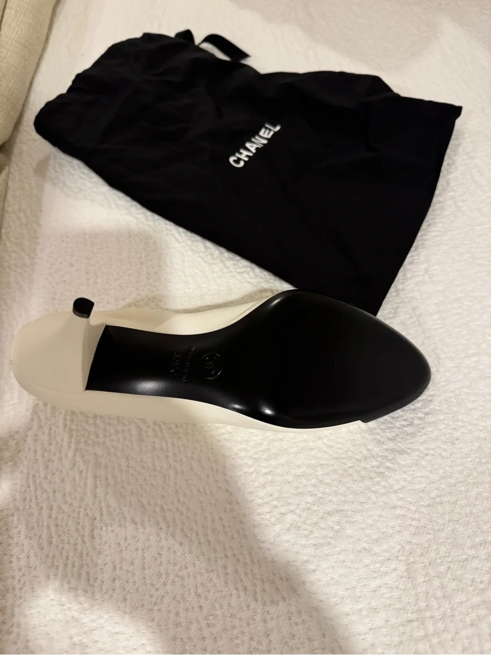 CHANEL Two-Tone White Leather Pumps with Black Cap Toe